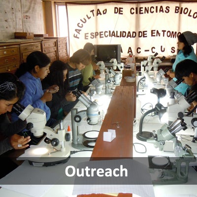students at a table with microscopes (c) UCR/CNAS